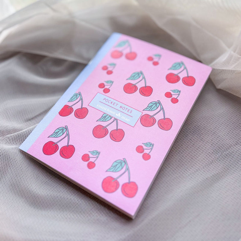 Red and pink cherry notebook, pocket size, 28 pages.